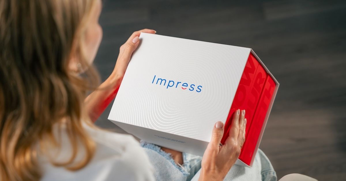 Patient holding her Impress treatment kit