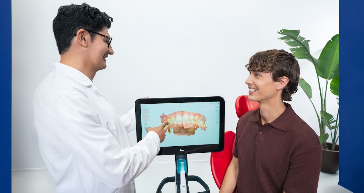 Patient and dentist discussing digital dental impressions