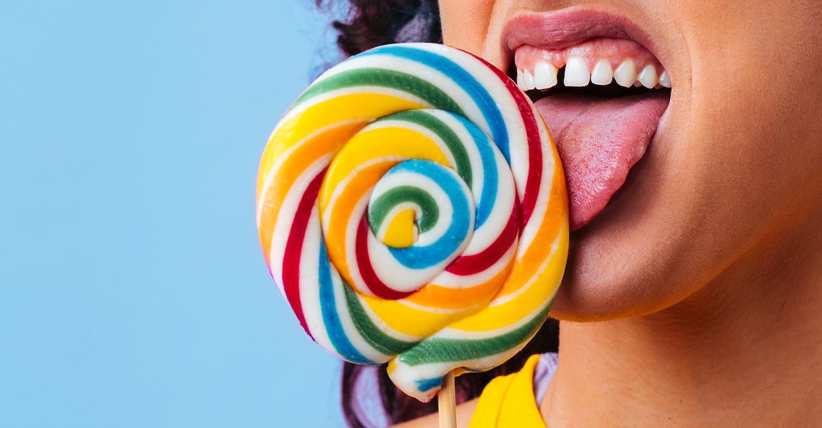 Child licking a lollipop