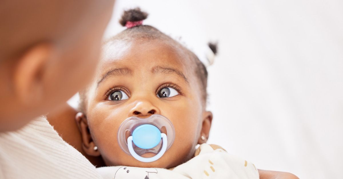 Cute toddler with pacifier