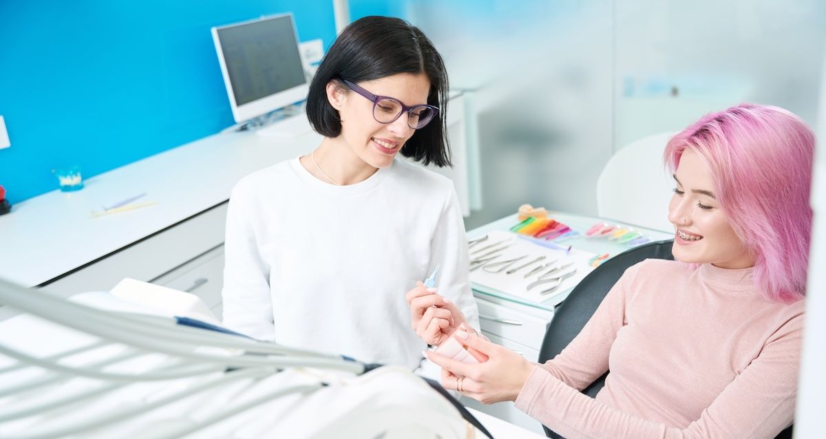 Patient and orthodontist discussing braces treatment